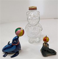 Lot 2 Mechanical Seal Toys plus Glass Piggy Bank