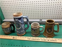 4 vintage mugs, 1 notre dame, 1 German, 1 Japan