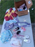 Doll close and baby clothes.