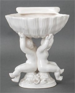 White Ceramic Shell Form Coupe Atop Two Cherubs