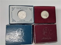 (2) George Washington commemorative half dollars