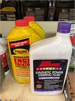 Two Rizlan engine treatment and one steering fluid