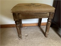 Vintage stool covered in grain sack
