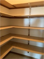 Particleboard shelves and brackets in pantry