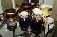 (2) antique copper luster and cobalt pitchers,