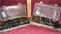 Two containers of fishing jigs