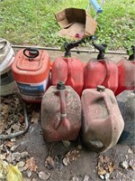 4 gas cans and contents