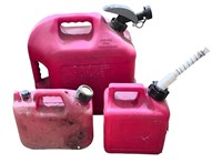 Three Plastic Red Gas Cans