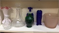 Shelf lot of colored glass, pink glass ice