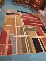 Black tan red geometric rug approx 9*11