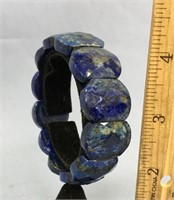 Stretch bracelet of faceted, lapis beads     (a 22