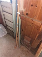 Yard tools, wooden poles, metal pipe