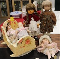 Doll Lot; 6 dolls, cradle; wooden doll w/ red cape