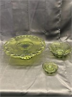 Three pieces of green glass one cake platter, two