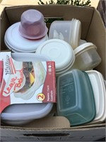 Box of plastic containers with lids