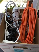 Box of extension cords and adapters