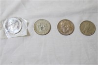 Lot of four silver dollar coins