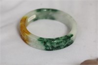 A Carved Jadeite Bangle Bracelet