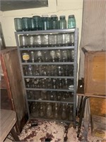 Metal shelf with canning jars