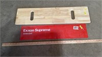 Woonden table, Exxon Supreme unleaded sign.