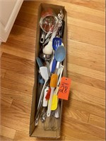 Assorted kitchen utensils, measuring cups