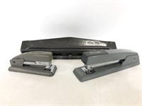 Swing line staplers and metal hole punch