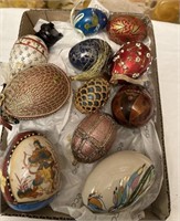 ELEVEN gilded and decorated eggs.