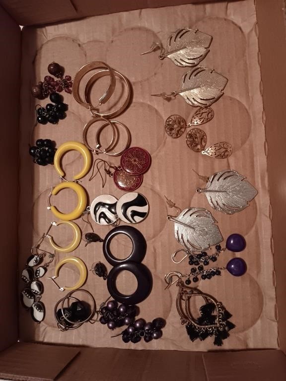 box of costume jewelry pairs of earrings