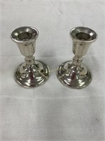 2 sterling weighted candle stick holders