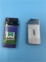 2 Lighters: 1 is an Asr, other has Marlboro on it
