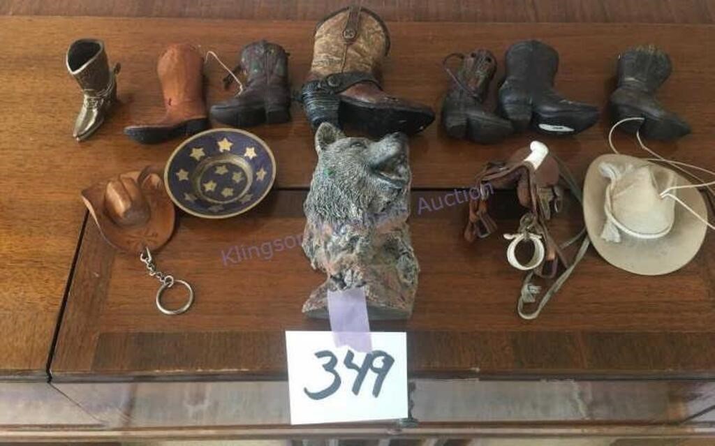 Small decorative western boots, hats, saddle and