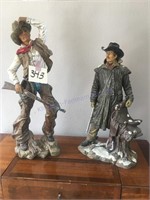 Two cowboy statues 24 inches tall and 21 inches
