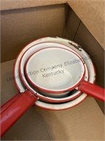 Box of vintage red and white enamelware