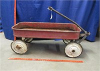 old rusty red wagon - white metal wheels