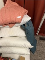 Comforter and Large Number of Bed Pillows