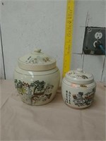 Two Asian decorative ceramic canisters with lids
