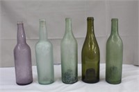Five vintage coloured bottles, 12"H