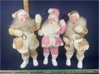 Three Santa Claus Figures