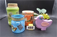 bright decorated jars and bird with succulents