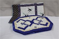 Hand stitched lap quilt and six placemats,