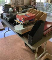 Heavy 5' folding table full of office supplies