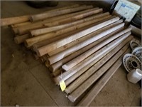 45+/- wood landscape posts in loft of garage