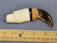 Large bear claw with ivory carving of a polar bear
