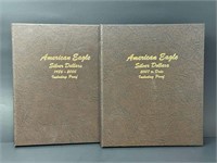 Two Empty American Eagle Silver Dollars Books