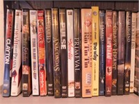 DVD movies & VHS tapes in half round bookcase