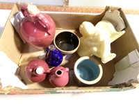 6 small pottery pieces and a candle