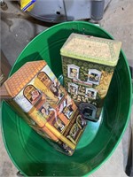 1 box of tins and a green tub with tins