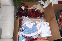 box of doll clothing and dolls