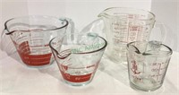 Lot of four glass measuring cups includes 3