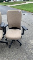2 tan office chairs 1 with stains
